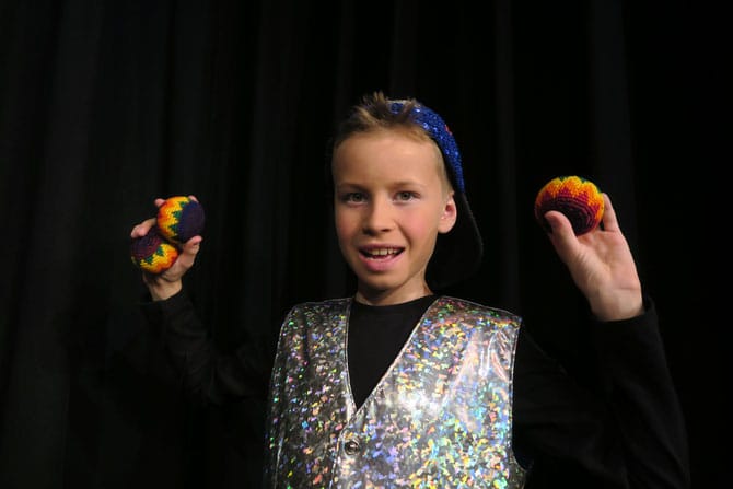 Child practicing juggling at the Circus Lab